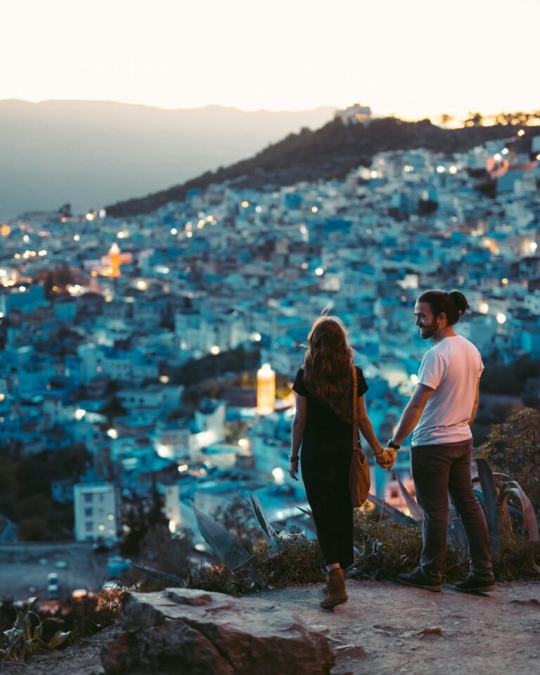Travellers looking out over an iconic African landscape, representing the 10 pillars of an unforgettable holiday with 54TravelVibes.